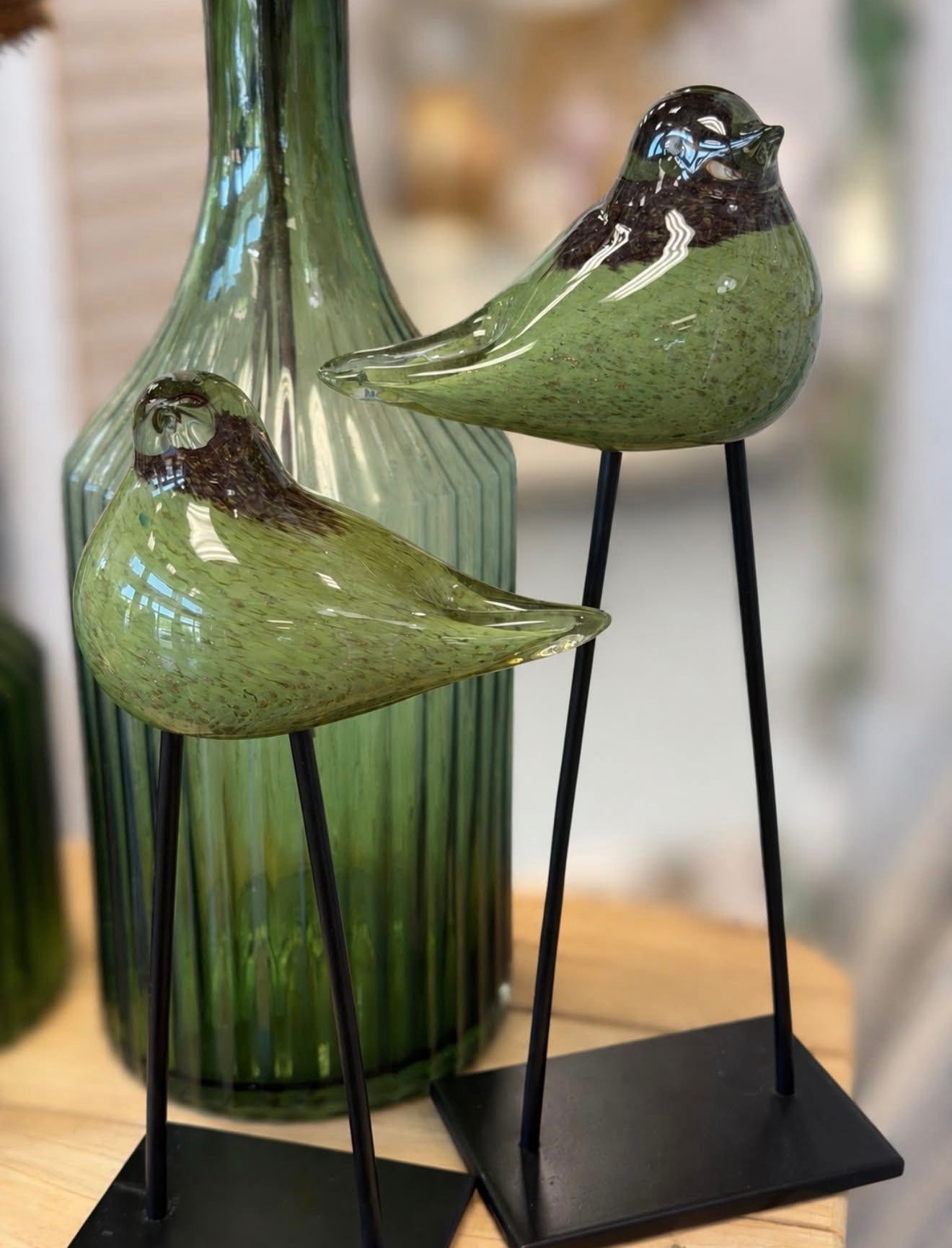 Green bird accents and decorative glass