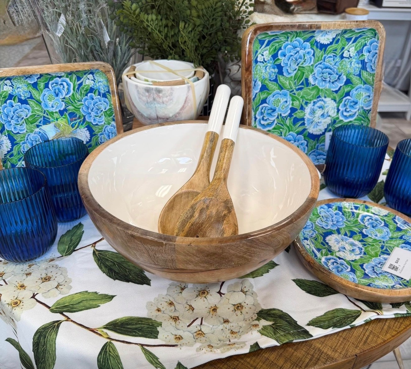 Blue and green tableware with a wooden serving bowl
